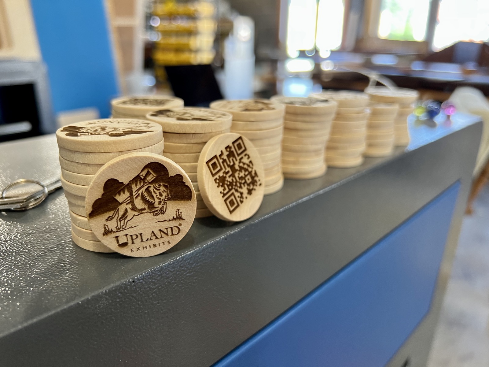 stacks of laser engraved upland coins